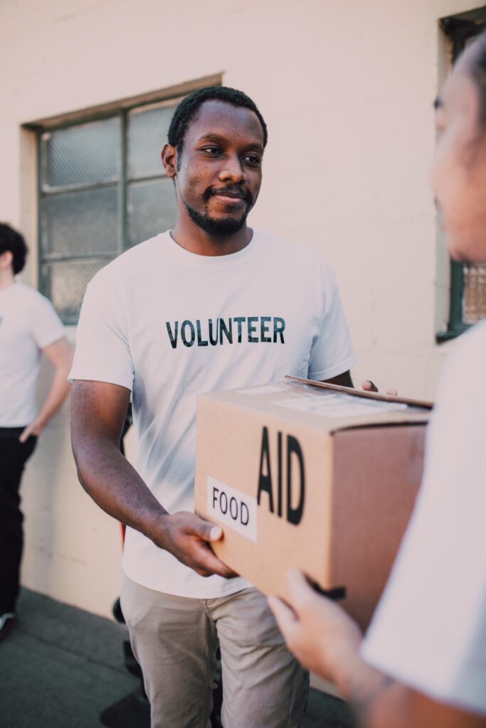Volunteer giving food